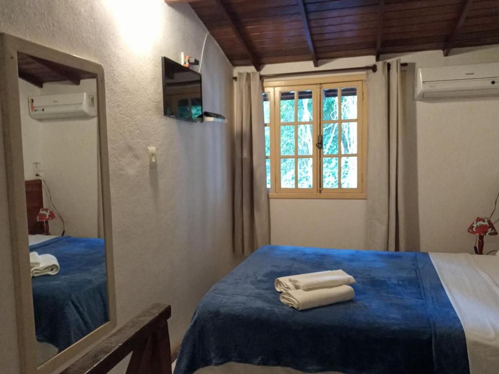Pitanga Ilha Grande客房内的一张或多张床位