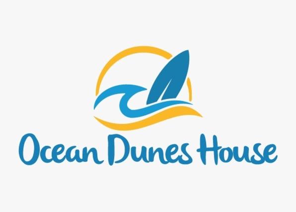 TamelaltOcean Dunes House的海舞之家的标志,有海豚