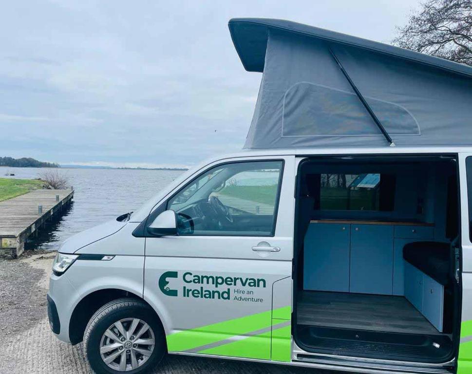 DardistownCampervan Ireland Rentals的停在水体旁边的白色货车