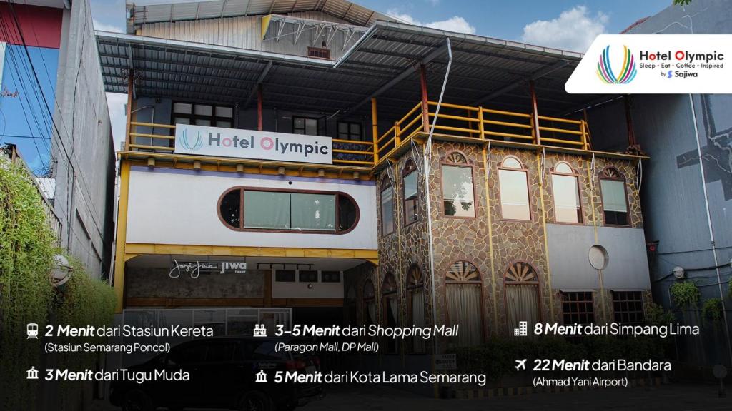 三宝垄Hotel Olympic Semarang by Sajiwa的建筑的侧面有标志