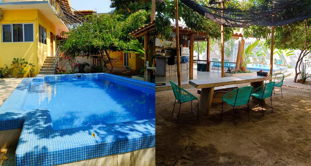 埃斯孔迪多港Paziflora Hostel的一座带游泳池和桌椅的房子