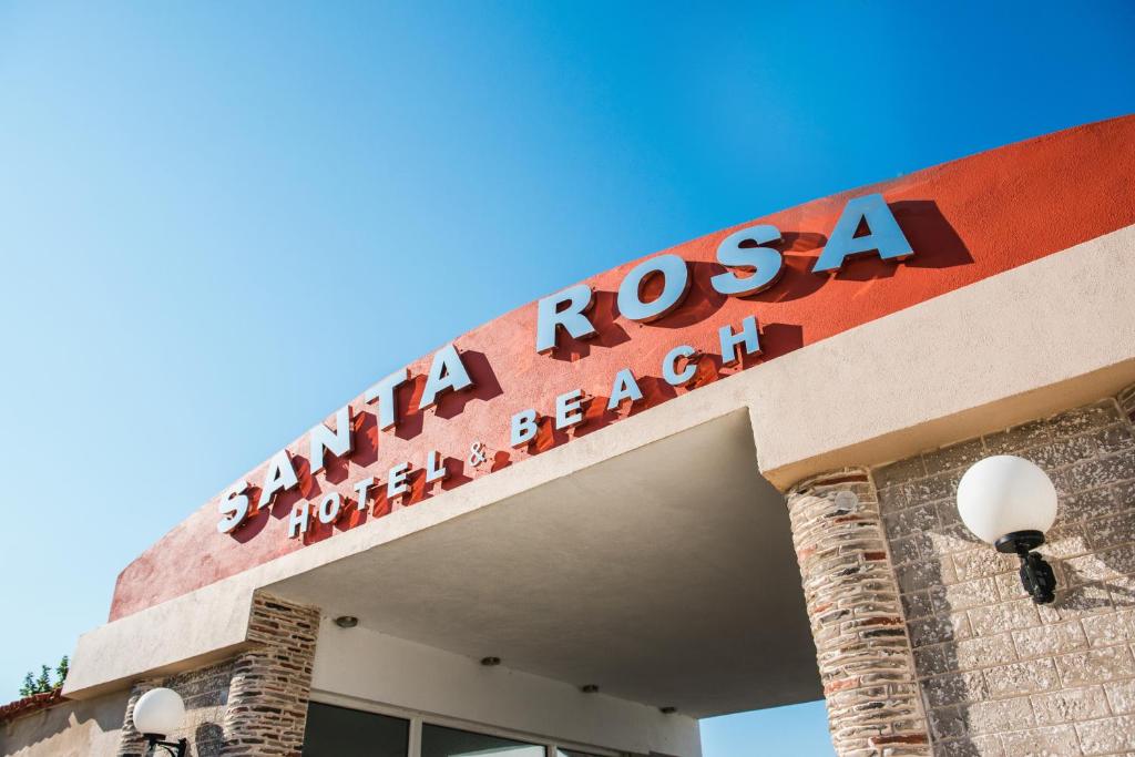 亚历山德鲁波利斯Santa Rosa Hotel & Beach的医院前的标志