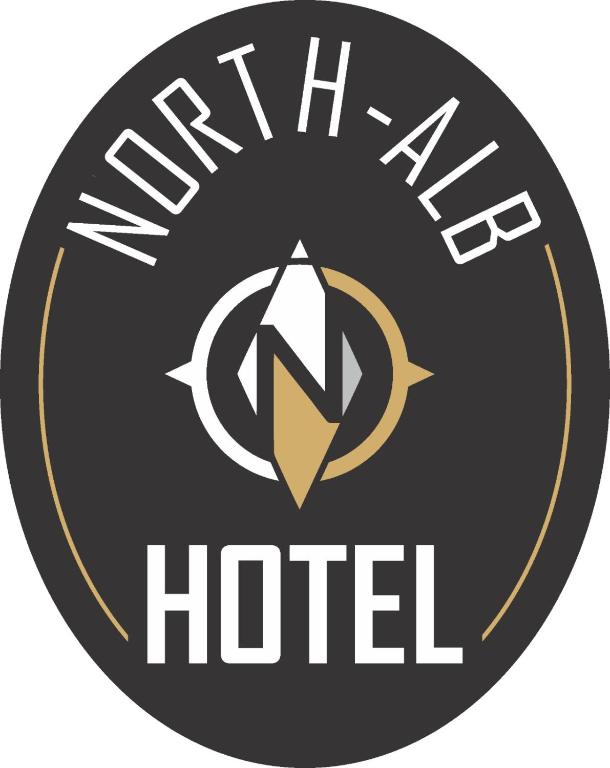 斯库台North Alb Hotel的带有盾牌和标志的酒店标志