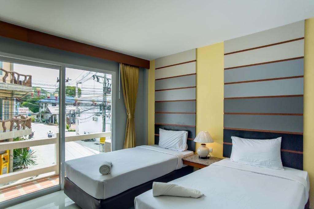 帕岸岛明珠别墅酒店客房内的一张或多张床位