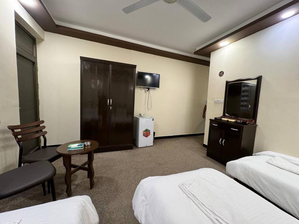 SAFIR BAGHDAD HoTEL客房内的一张或多张床位