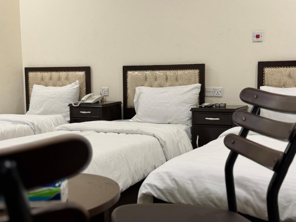 SAFIR BAGHDAD HoTEL客房内的一张或多张床位