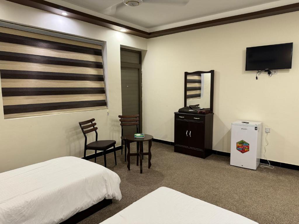 SAFIR BAGHDAD HoTEL客房内的一张或多张床位