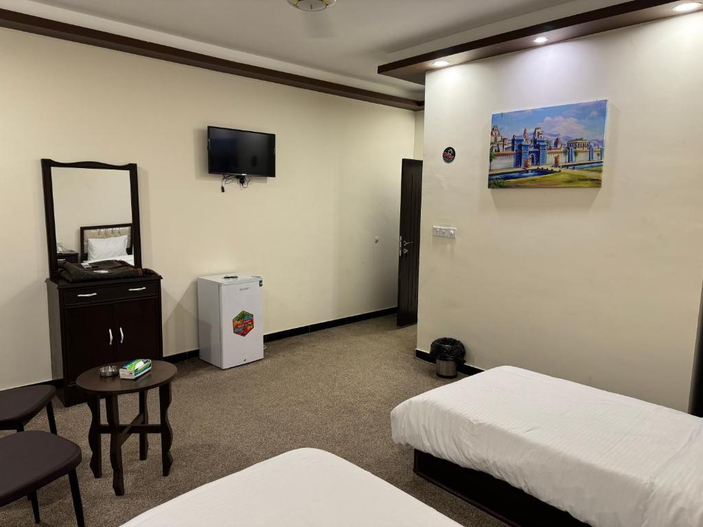 SAFIR BAGHDAD HoTEL的电视和&#47;或娱乐中心