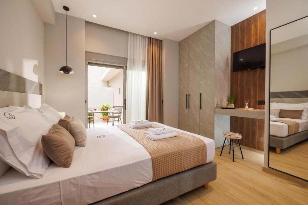Jolly Suites客房内的一张或多张床位