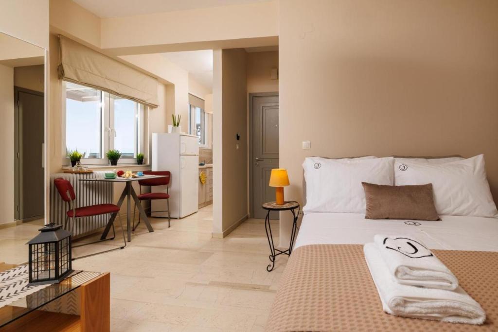 Jolly Suites客房内的一张或多张床位