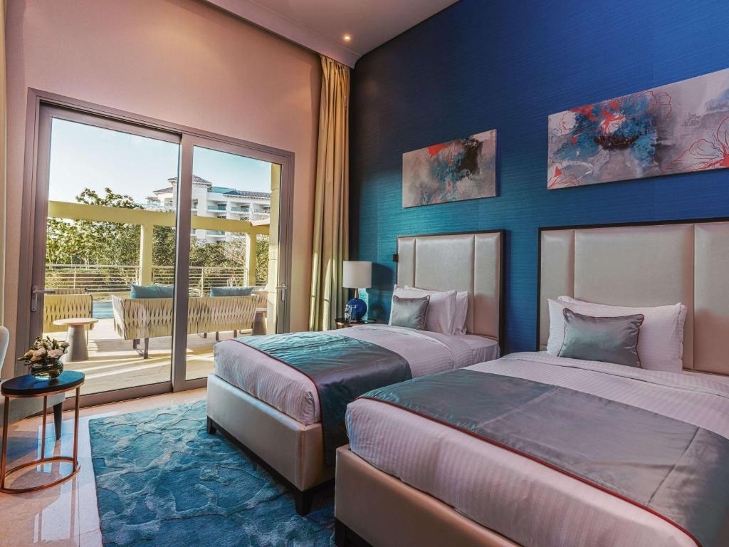 Rixos The Palm Hotel &amp; Suites - Ultra All Inclusive客房内的一张或多张床位