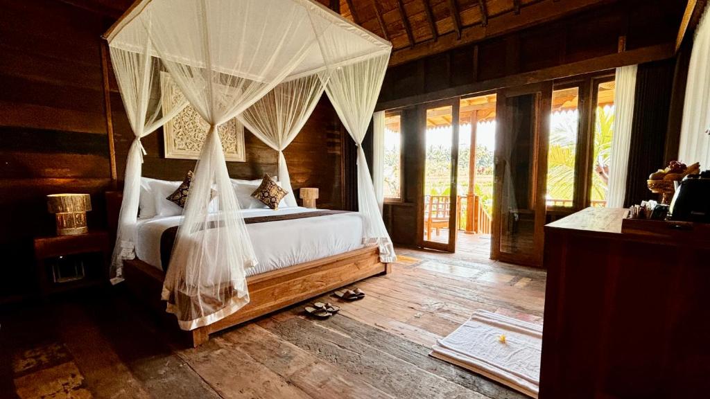Jagadhita Villas Ubud Bali客房内的一张或多张床位