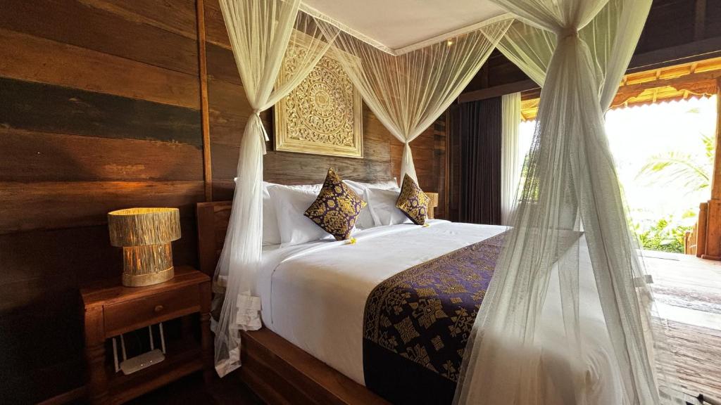 Jagadhita Villas Ubud Bali客房内的一张或多张床位