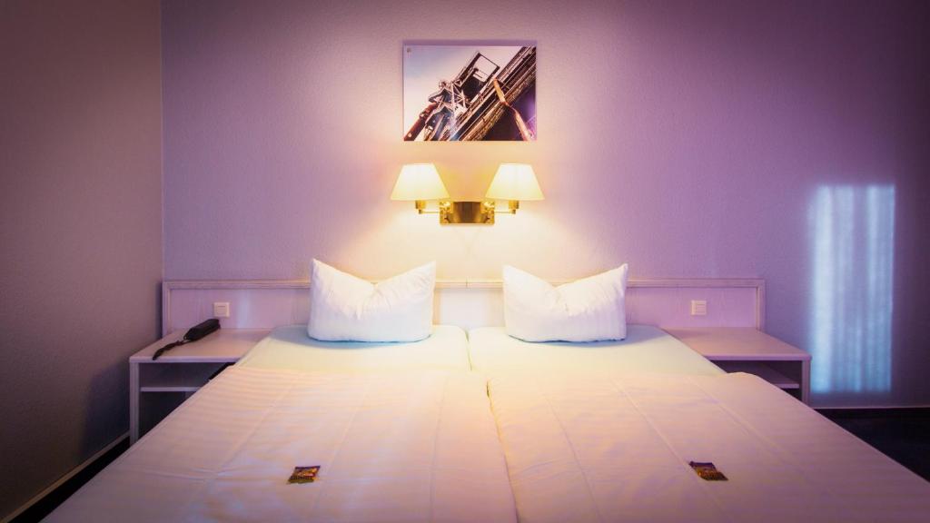 波鸿伊克赛尔瑟酒店客房内的一张或多张床位