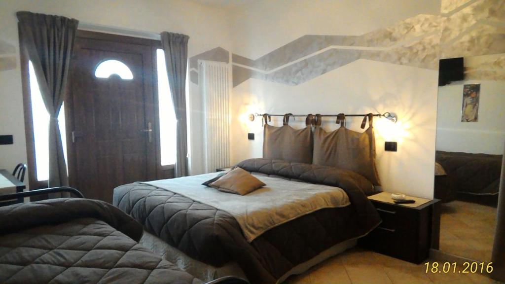 奥斯塔La Casa Del Grillo 1的卧室配有床,