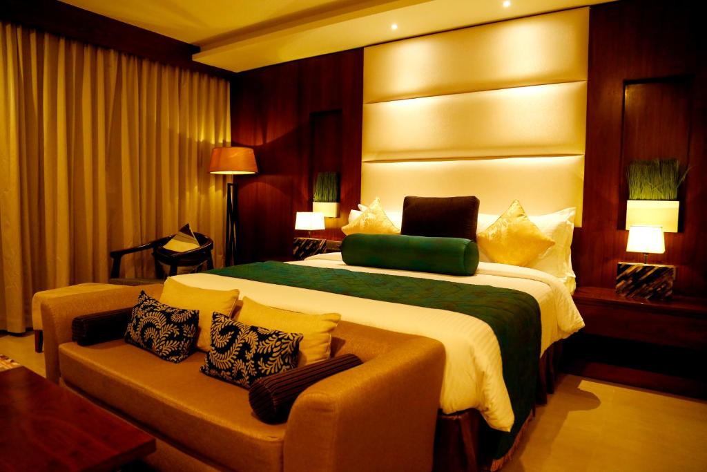 拉维兹卡利卡特酒店客房内的一张或多张床位