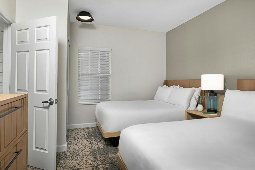 Sheraton Broadway Resort Villas客房内的一张或多张床位