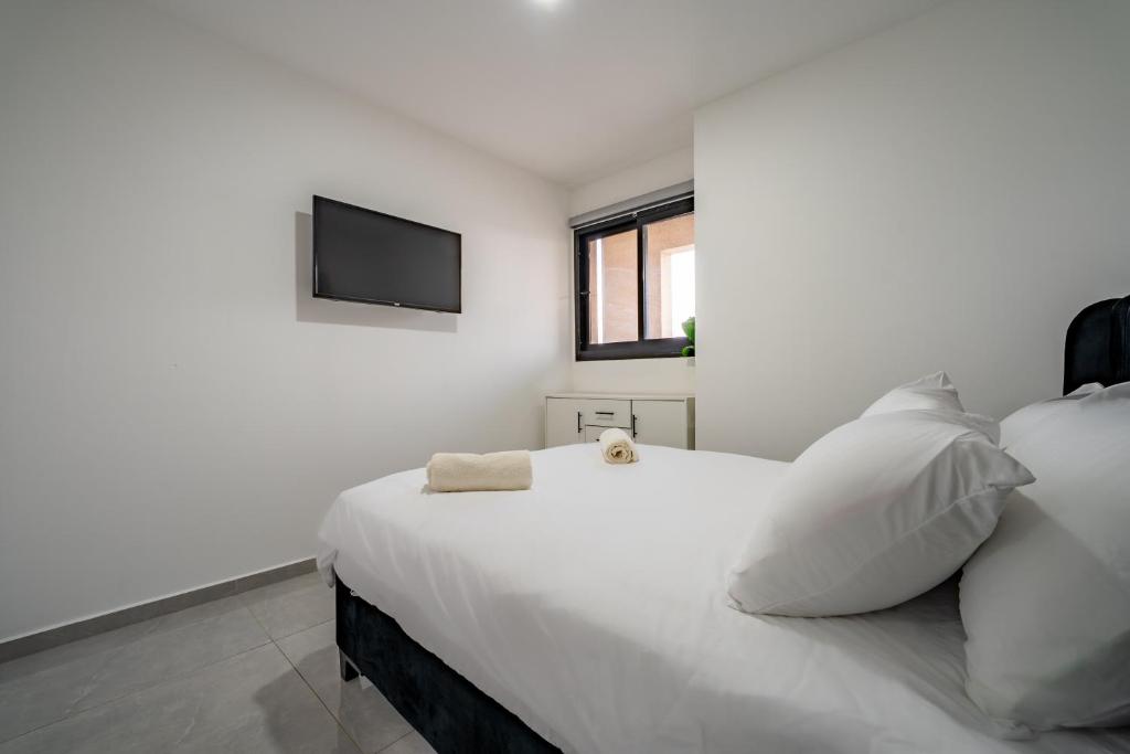 Amalfi Apartment - By Harim客房内的一张或多张床位