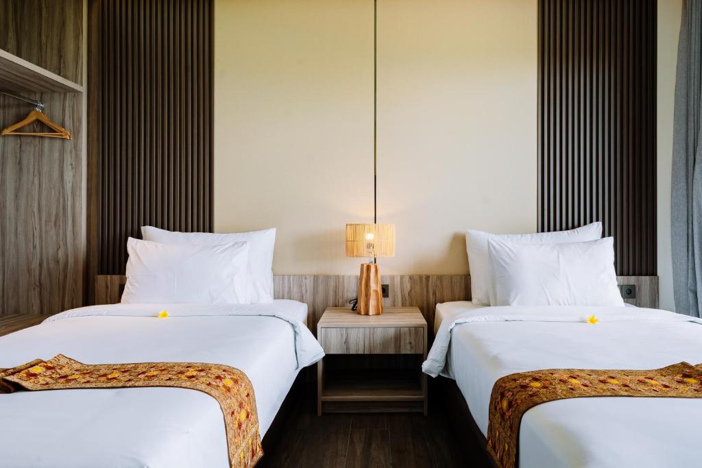 Big Dragon Villas Ubud客房内的一张或多张床位