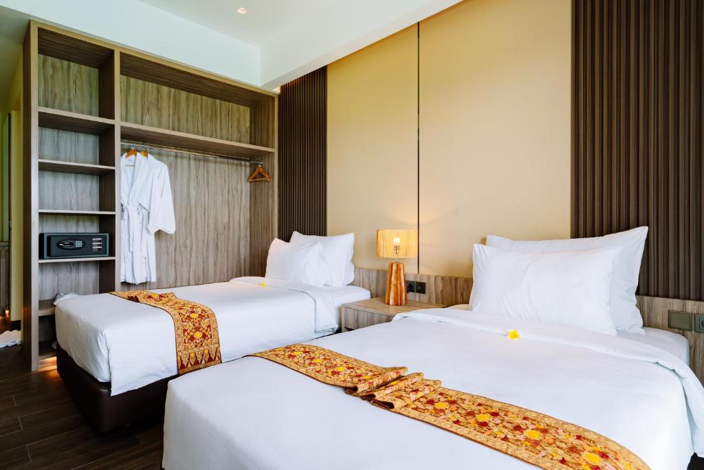 Big Dragon Villas Ubud客房内的一张或多张床位