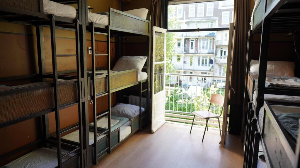 Onefam Amstel客房内的一张或多张床位