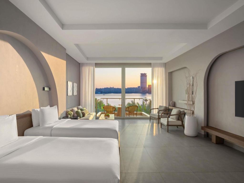 Rixos The Palm Hotel &amp; Suites - Ultra All Inclusive客房内的一张或多张床位