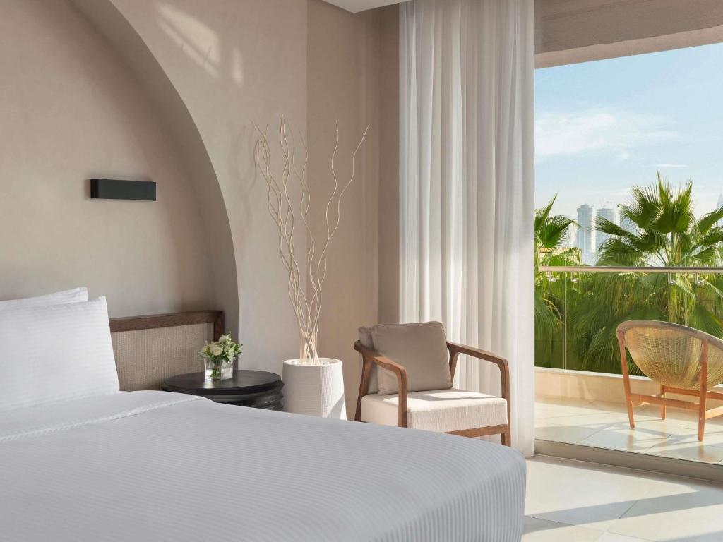 Rixos The Palm Hotel &amp; Suites - Ultra All Inclusive客房内的一张或多张床位