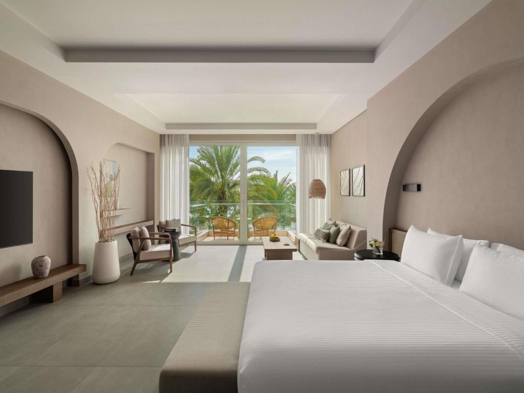 Rixos The Palm Hotel &amp; Suites - Ultra All Inclusive客房内的一张或多张床位