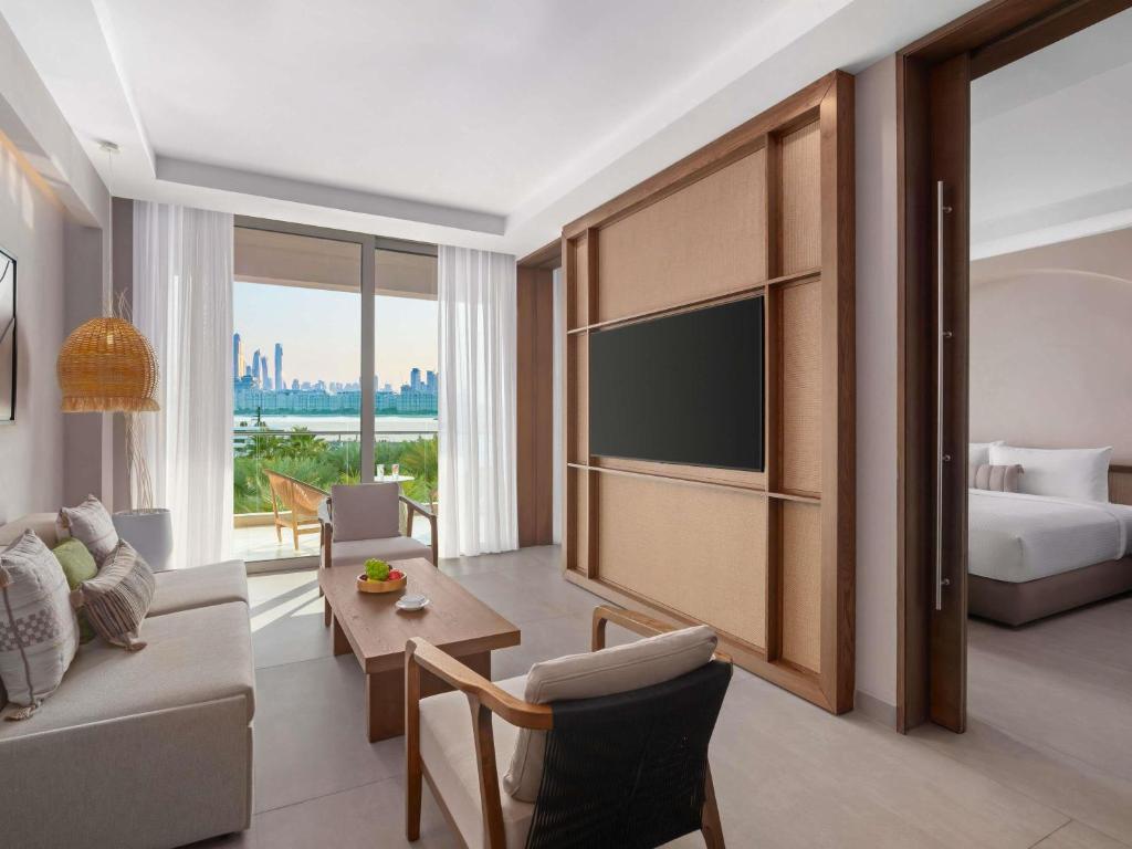 Rixos The Palm Hotel &amp; Suites - Ultra All Inclusive客房内的一张或多张床位