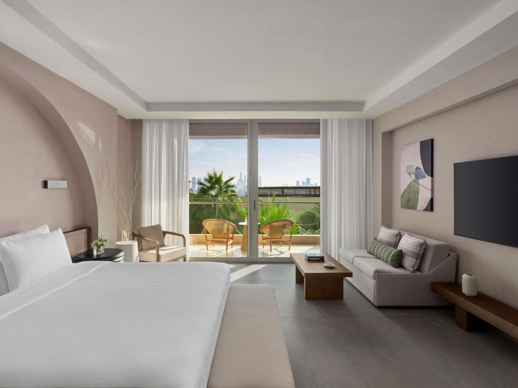 Rixos The Palm Hotel &amp; Suites - Ultra All Inclusive客房内的一张或多张床位