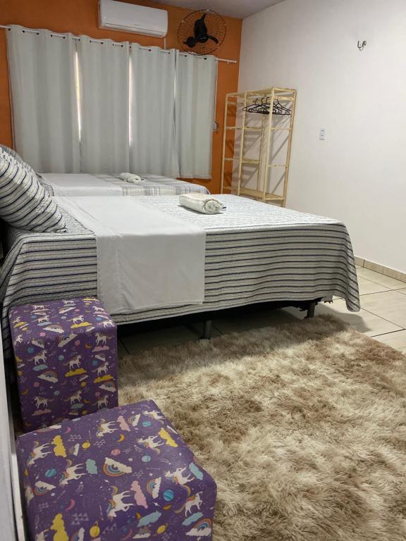 Hospedagem Aconchego Do Lar客房内的一张或多张床位