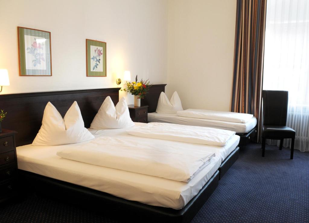 Der Fürstenhof客房内的一张或多张床位