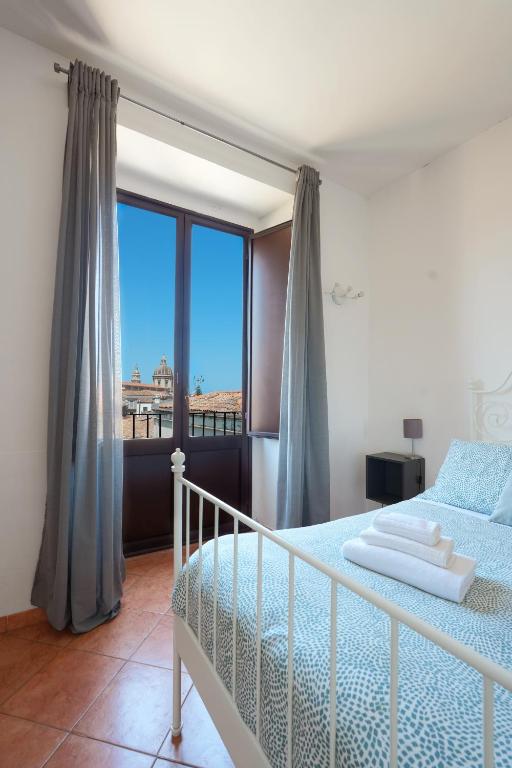 Palazzo Currò客房内的一张或多张床位