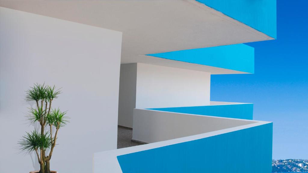 阿卡普尔科阿卡普尔科达拉多斯酒店的一间拥有蓝白色墙壁的房间,
