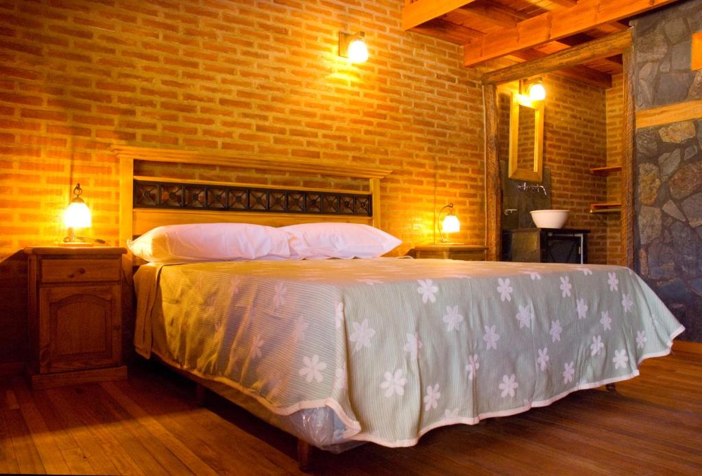 Lauquen Pilmaiquen y spa客房内的一张或多张床位