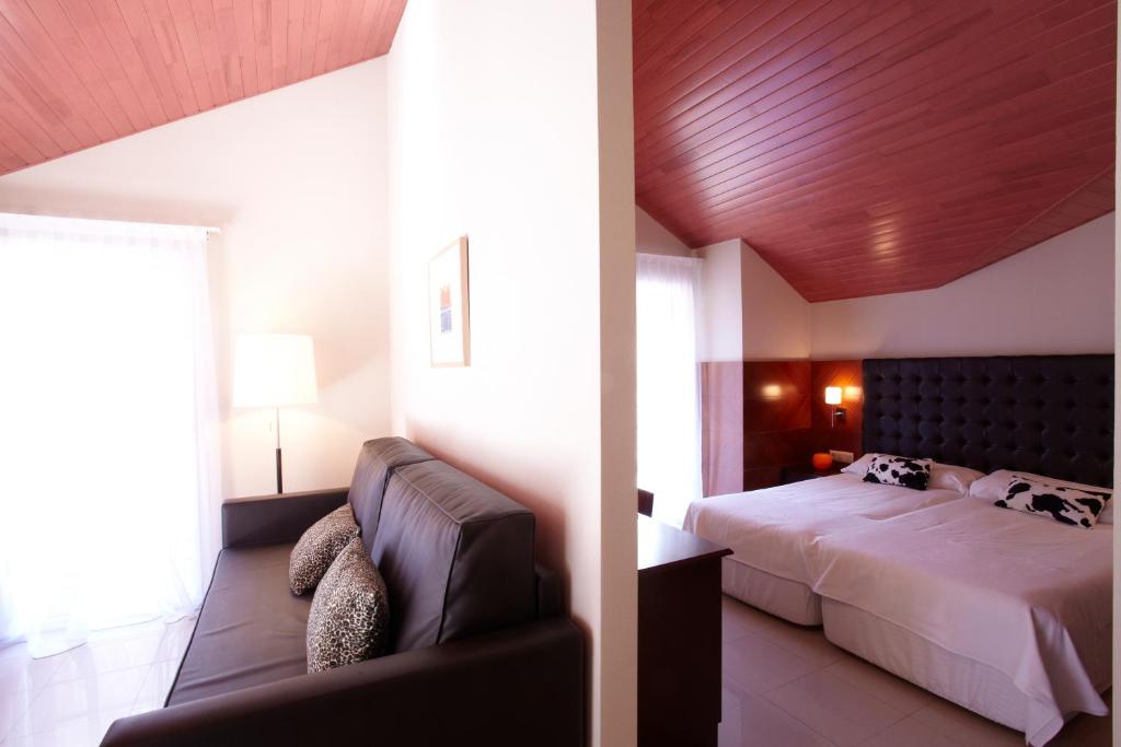 Hotel MU & SPA客房内的一张或多张床位