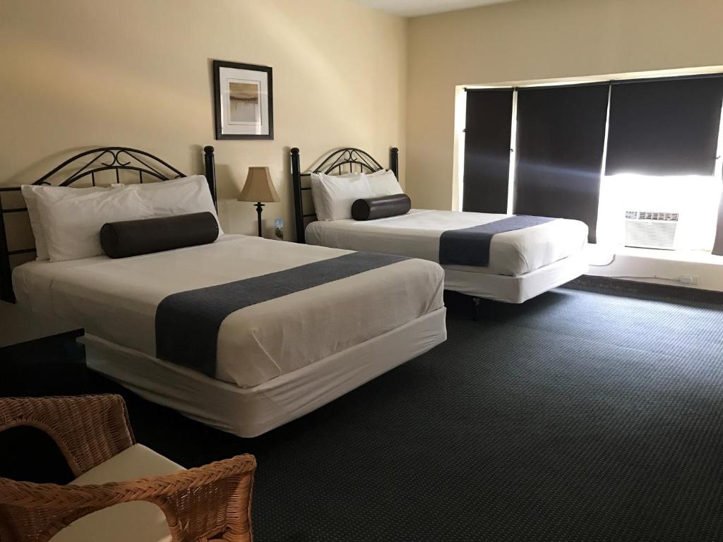 太阳海滩别墅酒店客房内的一张或多张床位