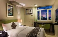 The Exchange Regency Residence Hotel Managed by HII客房内的一张或多张床位