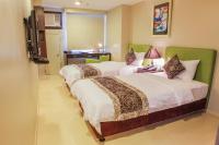 The Exchange Regency Residence Hotel Managed by HII客房内的一张或多张床位