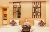 The Exchange Regency Residence Hotel Managed by HII客房内的一张或多张床位