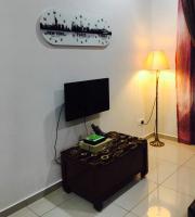 马六甲乌里希度假屋的电视和/或娱乐中心