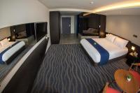Gloucester Hotel Jeju客房内的一张或多张床位
