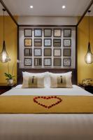 Allegro Hoi An . A Little Luxury Hotel & Spa客房内的一张或多张床位