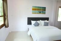 The Lodge at Koh Kood客房内的一张或多张床位