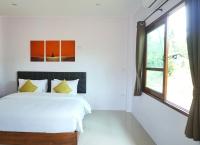 The Lodge at Koh Kood客房内的一张或多张床位
