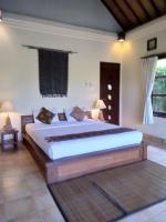 Ubud Lestari Bungalows客房内的一张或多张床位