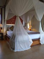 Ubud Lestari Bungalows客房内的一张或多张床位
