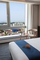 Gloucester Hotel Jeju客房内的一张或多张床位
