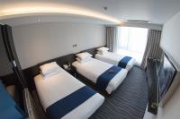 Gloucester Hotel Jeju客房内的一张或多张床位