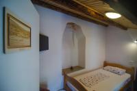 Traditional Piran house客房内的一张或多张床位